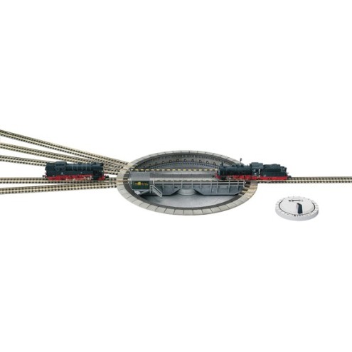 Fleischmann 9152 - Modell-Drehscheibe mit elektrischem Antrieb und elektrisch einzeln zuschaltbaren Gleisabgängen, mit Drehscheiben-Schalter 6910. Länge der Drehbrücke 183 mm.